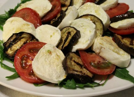 Caprese salad with bufalo mozzarella, tomatoes and grilled aubergines